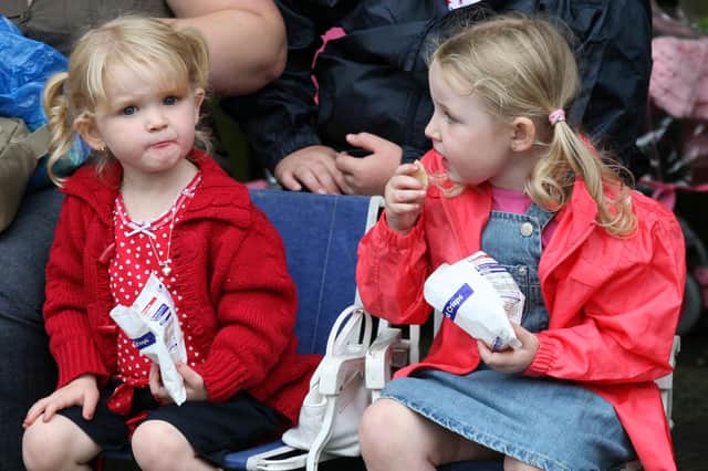 Enjoying a quick snack during the Twelfth parade in Ballymena. BT29-237AC