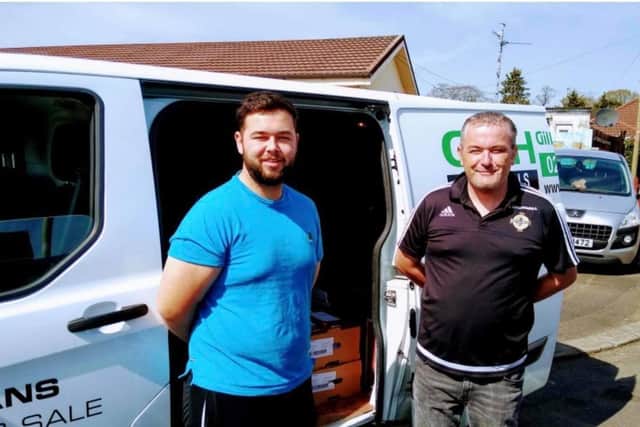 Jordon Russell with a volunteer who have been making thousands of food deliveries in recent weeks.