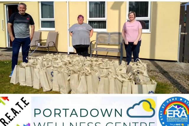 Phyllis Abraham. Stephen Elliott and Ruth Cranston delivering food parcels in the Portadown area .