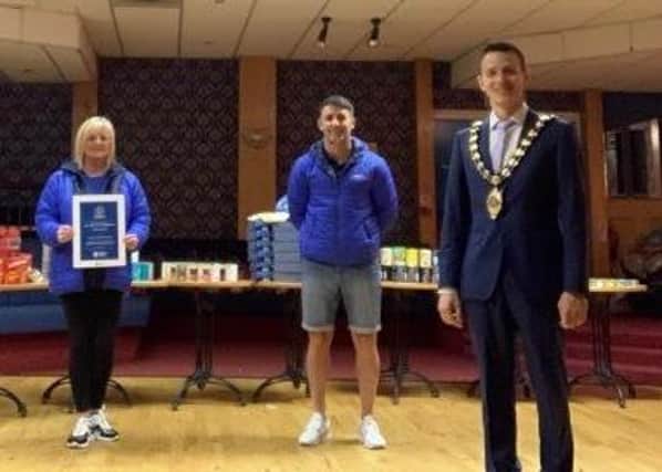 Kim Webb, Gareth McConnell and the Mayor of Mid and East Antrim, Councillor Peter Johnston.