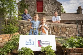 Pictured in Donagh Cottage Farm in Donaghcloney is Richard Primrose, Bank of Ireland UK Agri-Business Manager with Bank of Ireland Open Farm Weekend chairman and UFU deputy president David Brown with sisters Molly (5) and Edith Tumelty (4).  Picture by Brian Morrison.