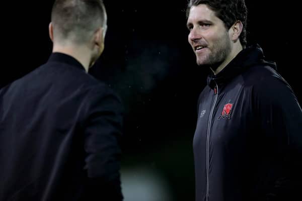 Ex-Dundalk coach Ruaidhri Higgins shares a joke with St Patrick's Athletic manager Stephen ODonnell.