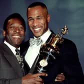 Newcastle Uniteds striker Les Ferdinand (right) is presented with the Player of the Year award by soccer legend Pele