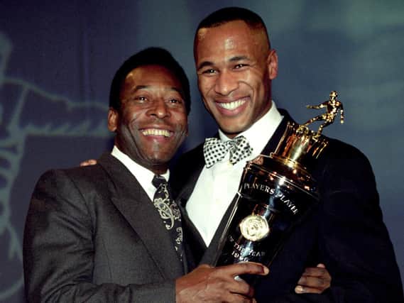 Newcastle Uniteds striker Les Ferdinand (right) is presented with the Player of the Year award by soccer legend Pele