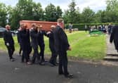 Mourners attending the burial of David Crocket at Burt Presbyterian Church in County Donegal today.