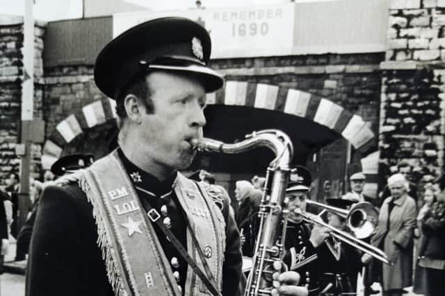George Cassidy from Hyndford Street in east Belfast playing the saxaphone during a Twelfth. Picture courtesy of Laura Cassidy
