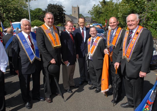 The Chairman of the Northern Ireland Tourist Board Howard Hastings (centre) and Niall Gibbons from Tourism Ireland are welcomed to the 2009 flagship Twelfth parade in Larne by (from left) Jim Robinson, David Boyd, David Hume, Roy Beggs MLA and Alderman Roy Beggs. LT29-355-PR