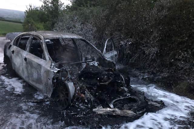 PSNI picture of burned out BMW car.
