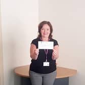 Geraldine McKay, Director of Acute Hospitals pictured receiving the cheque from City Colts.