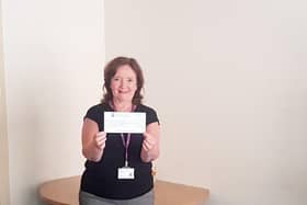 Geraldine McKay, Director of Acute Hospitals pictured receiving the cheque from City Colts.