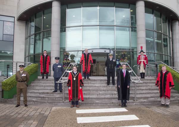 Pictured at the council's annual ceremony to raise the Armed Forces Day Flag are: (front l-r) Lieutenant Colonel Chris Wood; the Mayor, Councillor Nicholas Trimble; David Burns, Chief Executive and Alderman Paul Porter, Corporate Services Committee Chairman; (middle l-r) Commander Neil Meharg and Wing Commander Steve McCleery; (back l-r) Alderman Stephen Martin, Vice-Chair of Corporate Services Committee; Alderman James Tinsley, Armed Forces Champion and Andrew Carlisle, bugler.