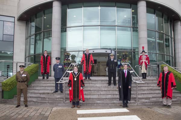 Pictured at the council's annual ceremony to raise the Armed Forces Day Flag are: (front l-r) Lieutenant Colonel Chris Wood; the Mayor, Councillor Nicholas Trimble; David Burns, Chief Executive and Alderman Paul Porter, Corporate Services Committee Chairman; (middle l-r) Commander Neil Meharg and Wing Commander Steve McCleery; (back l-r) Alderman Stephen Martin, Vice-Chair of Corporate Services Committee; Alderman James Tinsley, Armed Forces Champion and Andrew Carlisle, bugler.