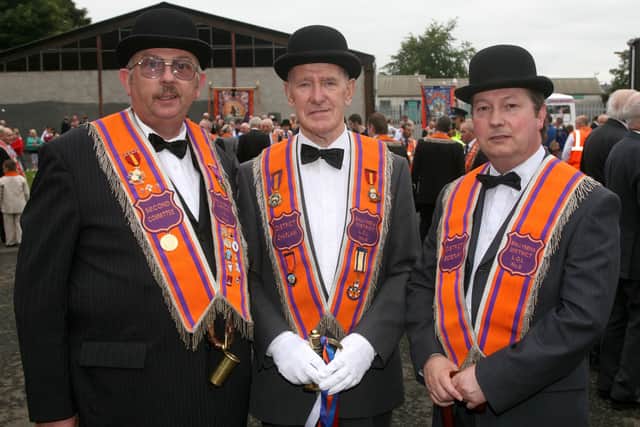 John Carson, William Stewart and Hubert Scullion, of District No. 8 at the Twelfth in Ballymena. BT29-228AC