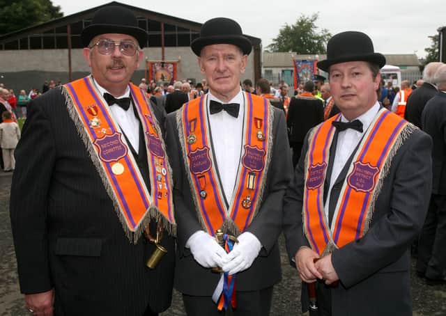 John Carson, William Stewart and Hubert Scullion, of District No. 8 at the Twelfth in Ballymena. BT29-228AC