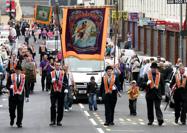Bands making their way up Wellington Street during the Twelfth parade in Ballymena. BT29-250AC