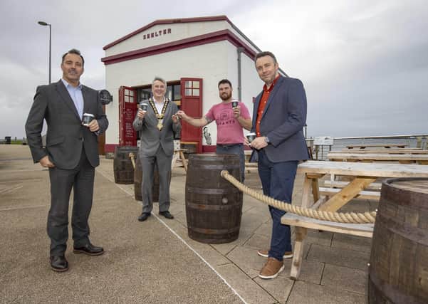 The Mayor of Causeway Coast and Glens Borough Council Councillor Richard Holmes pictured with (left – right) Richard McLaughlin from Northern Real Estate, Kevin McCarry, proprietor of Shanty Brews and Bites and Wayne Hall, Causeway Coast and Glens Borough Council’s Asset Realisation Officer