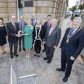 Bann Rowing Club Captain Keith Leighton receives a presentation from Lord-Lieutenant for County Londonderry Alison Millar alongside the Mayor of Causeway Coast and Glens Borough Council Councillor Richard Holmes, Sandra Adair, NI representative of the QAVS scheme (second left) and Deputy Lieutenants who attended the special event at Coleraine Town Hall