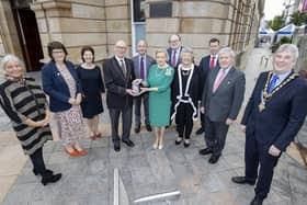 Bann Rowing Club Captain Keith Leighton receives a presentation from Lord-Lieutenant for County Londonderry Alison Millar alongside the Mayor of Causeway Coast and Glens Borough Council Councillor Richard Holmes, Sandra Adair, NI representative of the QAVS scheme (second left) and Deputy Lieutenants who attended the special event at Coleraine Town Hall