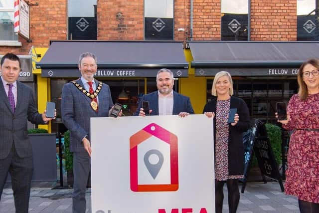 Gerard Murray and Neil Richardson, Department for Communities, Mayor Cllr William McCaughey, Lesley McCaughan, Follow Coffee, one of the local businesses offering a special opening deal with the new app, and Emma McCrea, Ballymena BID