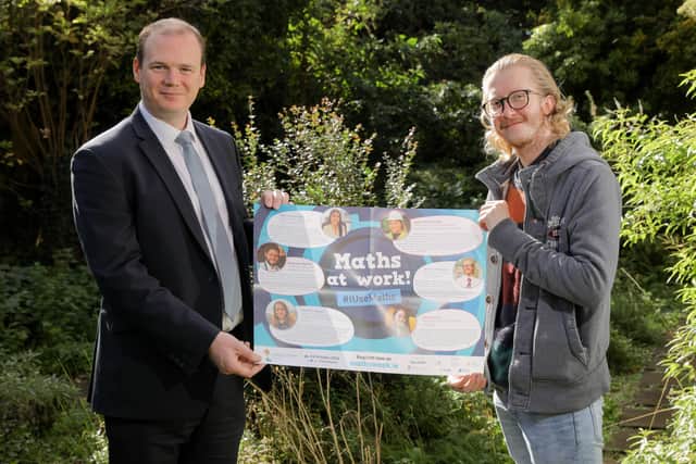 Ballyclare man, Aaron Howarth, an optical assistant at Specsavers in Abbey Centre, joins Economy Minister, Gordon Lyons MLA to mark this year’s Maths Week.