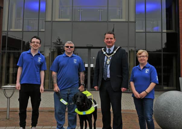 Lord Mayor of Armagh City, Banbridge and Craigavon, Alderman Glenn Barr with Leslie Massey from Portadown, Mrs Stephanie Massey, son Rhys,and guide dog Monroe.