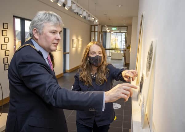 Andrea Spencer discusses her work in the Beyond Edges exhibition with the Mayor of Causeway Coast and Glens Borough Council Councillor Richard Holmes