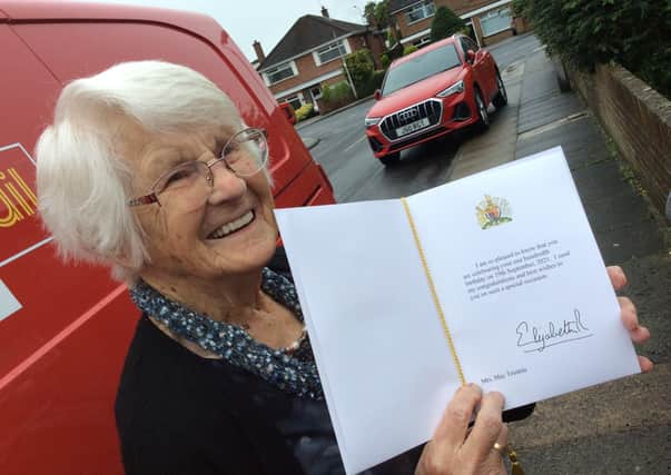 May Trimble with the card from the Queen to mark her 100th birthday.