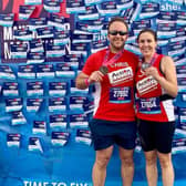County Antrim Harriers, Chris and Suzanne Dickey, celebrate finishing the Therme Manchester Marathon.