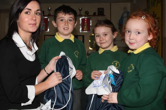 Pupils from St Mary’s Primary School Cargan who were winners in the Ballymena Credit Union Schools Saving Scheme draw received their prizes from staff member Louise Merrigan. L-R, Eamon Fyfe, Aoife Kelly and Clodagh Slattery. BT46-102JC
