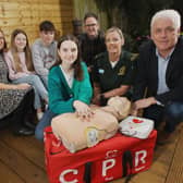 Back row L-R:  Mum Nicola King, Lucy’s sister Olivia, brother Thomas and dad Richard. Front row L-R: Lucy King who survived a cardiac arrest, Stephanie Leckey Community Resuscitation Lead with  NIAS, Fearghal McKinney Head of BHF NI