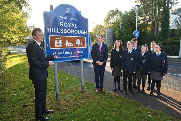 Mayor of Lisburn & Castlereagh City Council, Alderman Stephen Martin and First Minister Paul Givan MLA unveiled the new Royal Hillsborough signage with pupils from Beechlawn School.