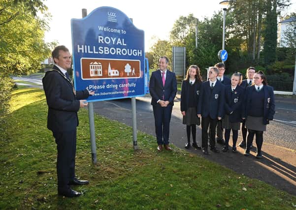 Mayor of Lisburn & Castlereagh City Council, Alderman Stephen Martin and First Minister Paul Givan MLA unveiled the new Royal Hillsborough signage with pupils from Beechlawn School.