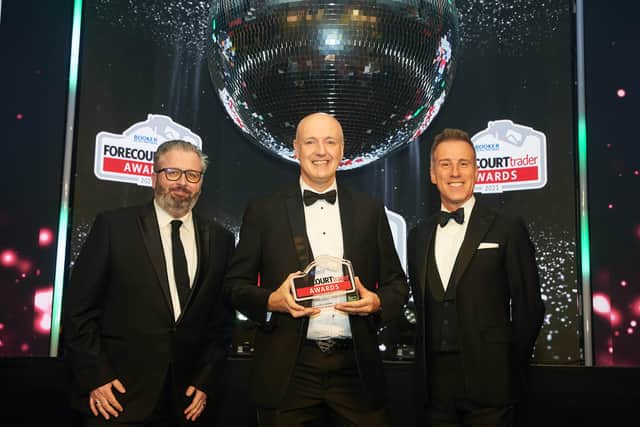 Adrian Mellon, store manager at Spar Fortfield (centre), receiving the award for Best Coffee and Hot Beverage Outlet at the 2021 Forecourt Trader Awards. Also pictured is Daniel Eversfield from The Forecourt Show and host, Anton de Beke.