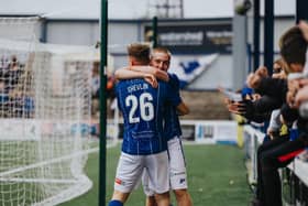 Conor McKendry congratulates Matthew Shevlin after his second goal. PICTURE: David Cavan