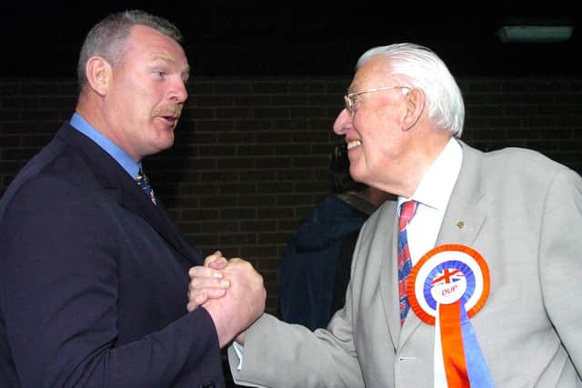DUP leader Rev Ian Paisley is congratulated on winning his North Antrim in 2012 seat by David Tweed, who served as both a DUP and TUV councillor on Ballymena Council. PICTURE BY STEPHEN DAVISON