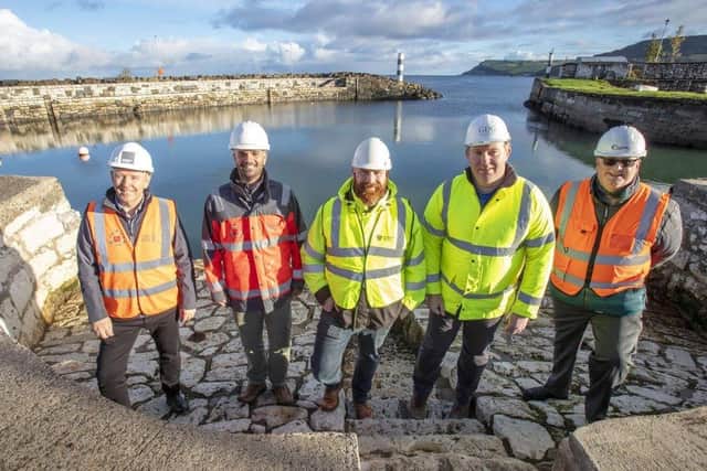 Patrick Harney and Miguel Oliveira of Charles Brand, Colin Morrison of Mid and East Antrim Council, William Brown of GDG and Ciaran Cunningham of Foyle Marine & Dredging at Carnlough harbour.