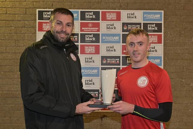 NIFWA Championship Player of the Month for October Richard Purcell receives his Belleek trophy from Ballyclare Comrades manager Paul Harbison
