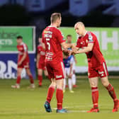 Portadown’s Greg Hall (right) celebrating with centre-back partner Paul Finnegan against Linfield. Pic by Pacemaker.