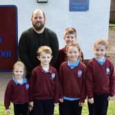 Mr Stringer pictured with some of Upper Ballyboley Primary School's pupils.