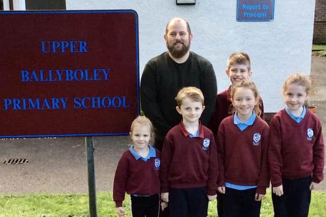 Mr Stringer pictured with some of Upper Ballyboley Primary School's pupils.