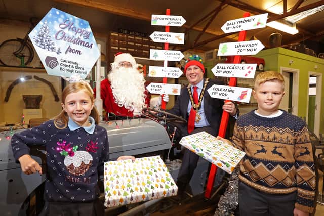 The Mayor of Causeway Coast and Glens Borough Council Councillor Richard Holmes joins Santa Claus and Garvagh Primary School pupils Reuben Catherwood and Siri McFetridge in Garvagh Museum ahead of the Christmas Cavalcade which will visit nine towns in the Borough during November and December