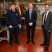 Economy Minister Gordon Lyons with NRC student Pierce Brown and Principal of NRC Mel Higgins at the college's Farm Lodge welding training facility in Ballymena.