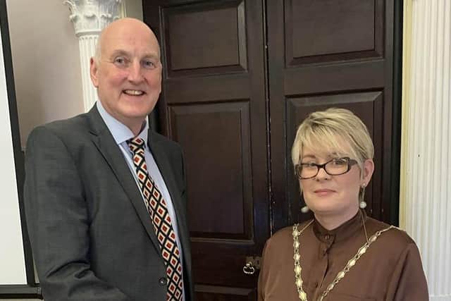 Outgoing President, Garry MacDonald congratulates Dr Katrina Collins on her election as the 50th president of Lisburn Chamber of Commerce.