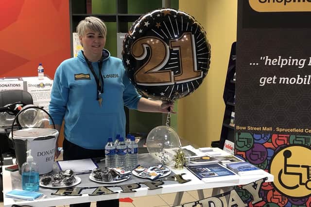 Senior Volunteer, Louise Cairnduff Rodgers, helping out at the 21st celebratory event at Bow Street Mall