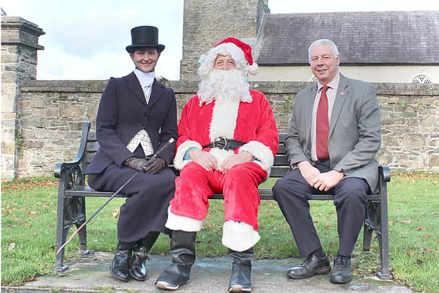 Santa Claus himself with Megan Hamill (left) and Councillor Robert Burgess in Saintfield Town launching the 2021 Saintfield Christmas Charity Ride which takes place on Saturday 4th, December