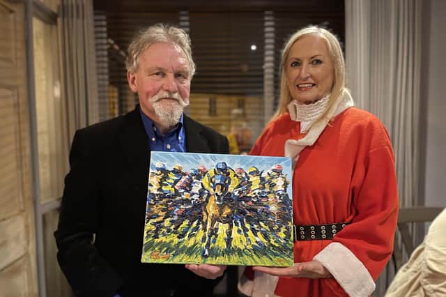 One of Ireland's leading equestrian artists Leo Casement presented Joan Cunningham organiser of the Saintfield Christmas Charity Ride with one of his fabulous paintings StarBurst to be auctioned to raise funds for the Saintfield Christmas Charity Ride which takes place on Saturday 4th December