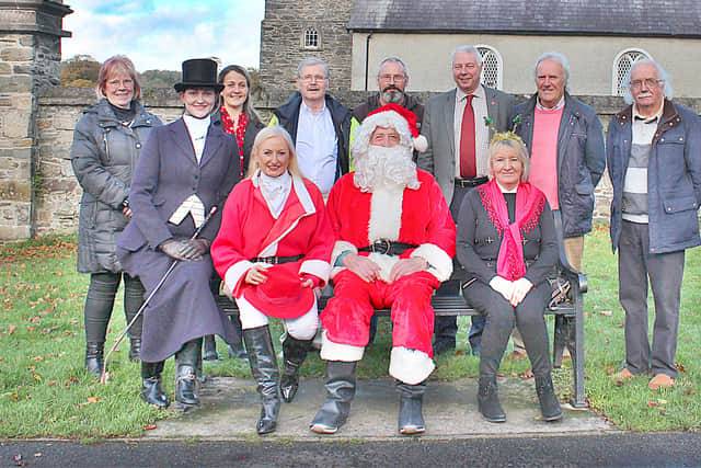 Saintfield Christmas Charity ride organiser (front row) Joan Cunningham and Santa Claus (centre) with from left, Megan Hamill and Vi Patterson. Back row, from left, Rosemary Murphy, Bree Rutledge, Michael Andrews, Maurice Hanna, Robert Burgess. Derek Spencer and Robin Patterson in Saintfield Town launching the 2021 Saintfield Christmas Charity Ride which takes place on Saturday 4th December