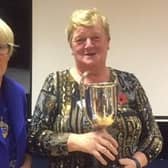 Muckamore WI president Elizabeth Gray presents the Rebecca McCourt trophy for past competitions to Joan Gray.