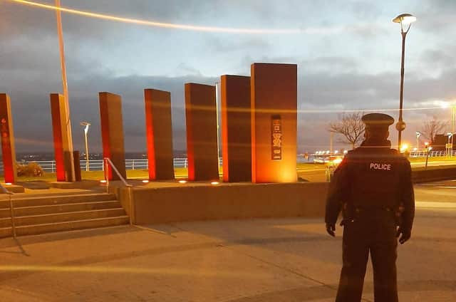 Police patrol at Carrickfergus War Memorial.