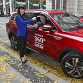 Infrastructure Minister Nichola Mallon has presented the Rathlin Development and Community Association with the keys to their new community e-vehicle. She is pictured presenting the keys to Michael Cecil, Chair of the Association